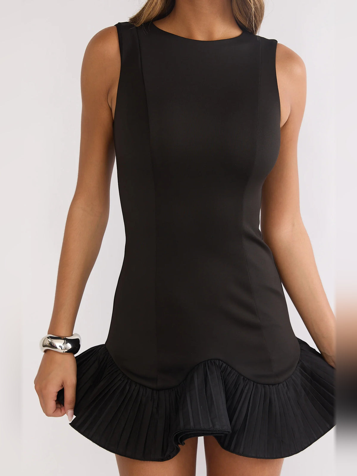 Black mini homecoming dress, alternate view showing the dress shape and hem