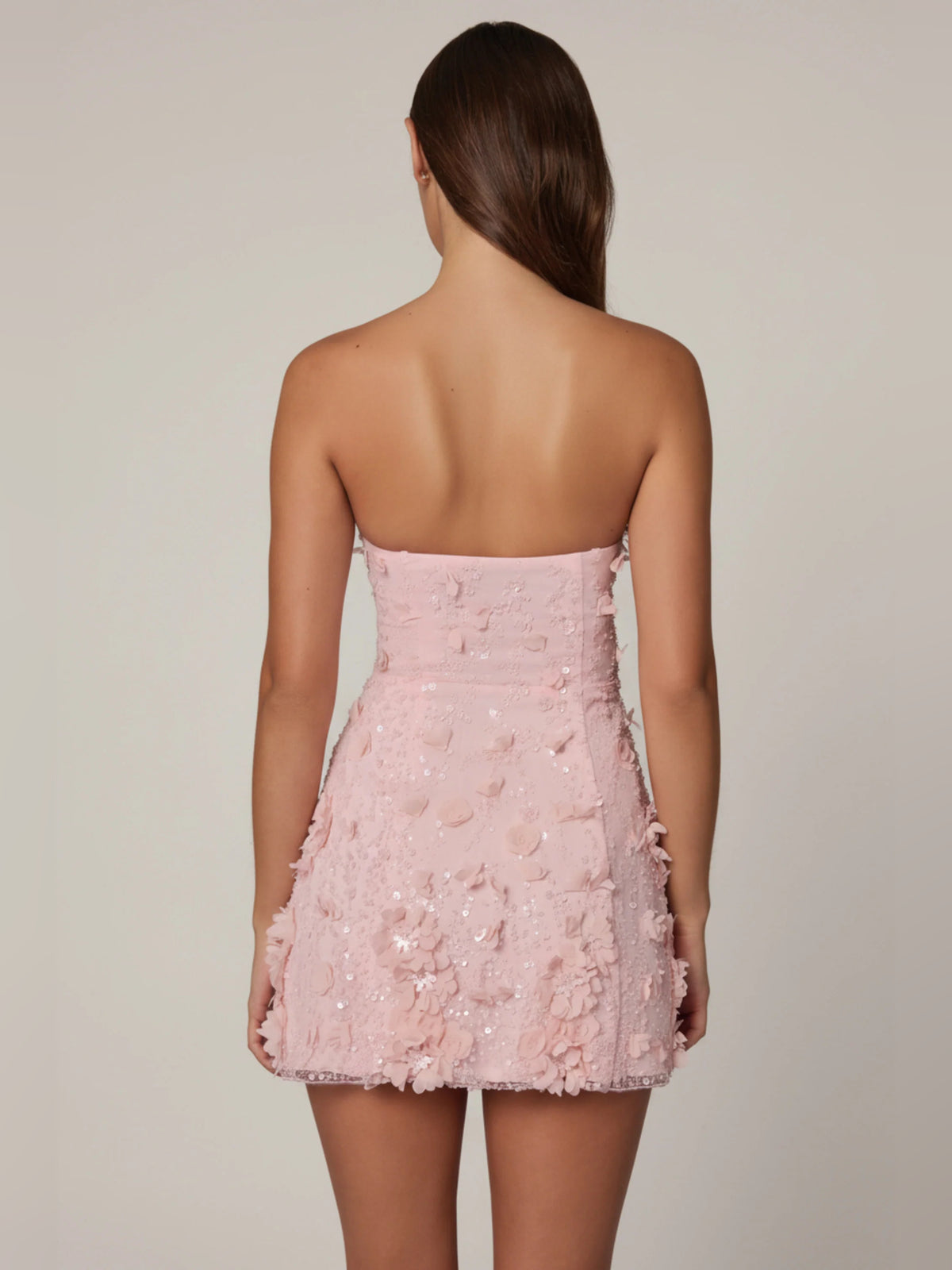 Pink mini homecoming dress, alternate view showing the dress shape and hem