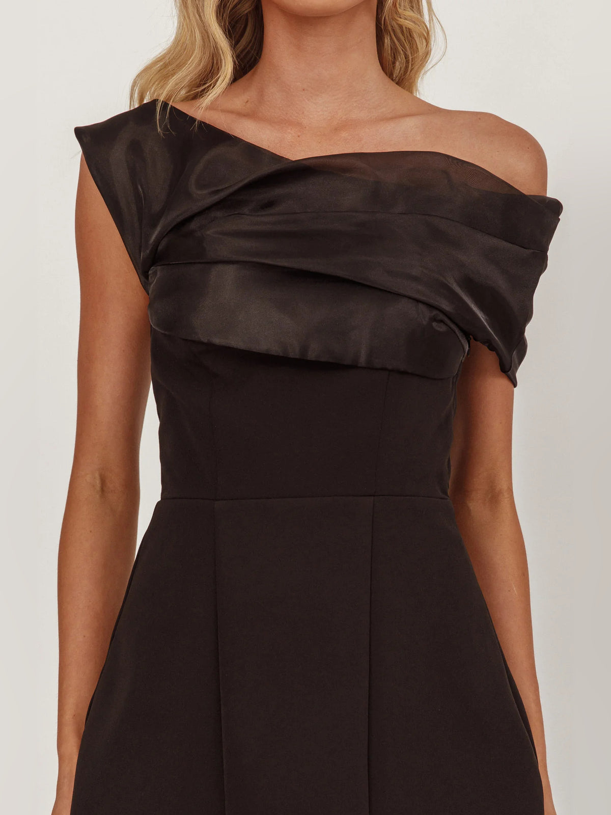 Black mini homecoming dress, alternate view showing the dress shape and hem