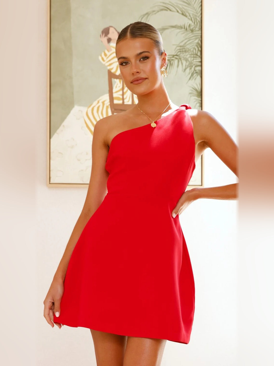 Red mini homecoming dress, alternate view showing the dress shape and hem