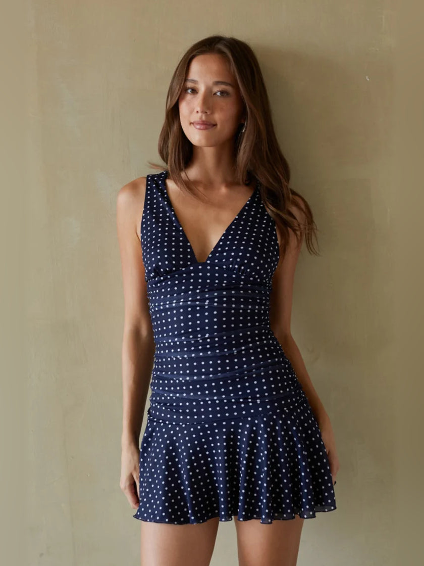 Orange mini homecoming dress, alternate view showing the dress shape and hem