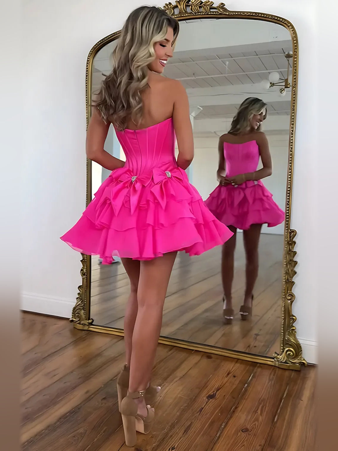 Black mini homecoming dress, alternate view showing the dress shape and hem