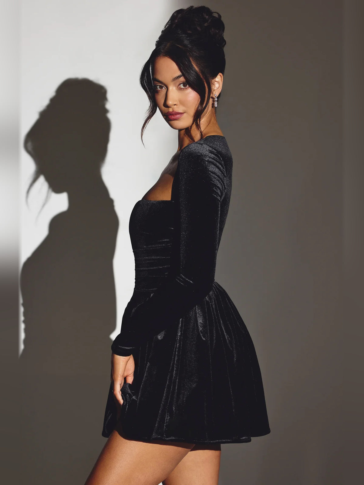 Black mini homecoming dress, alternate view showing the dress shape and hem