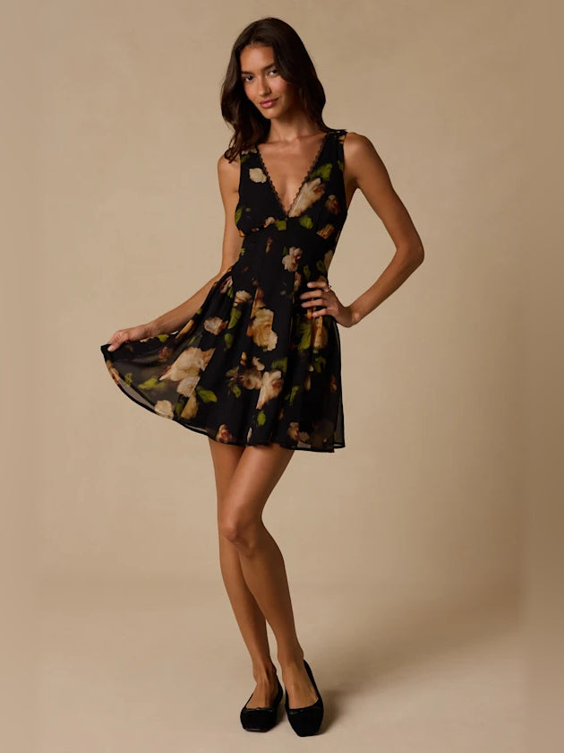 Black Floral mini homecoming dress, alternate view showing the dress shape and hem