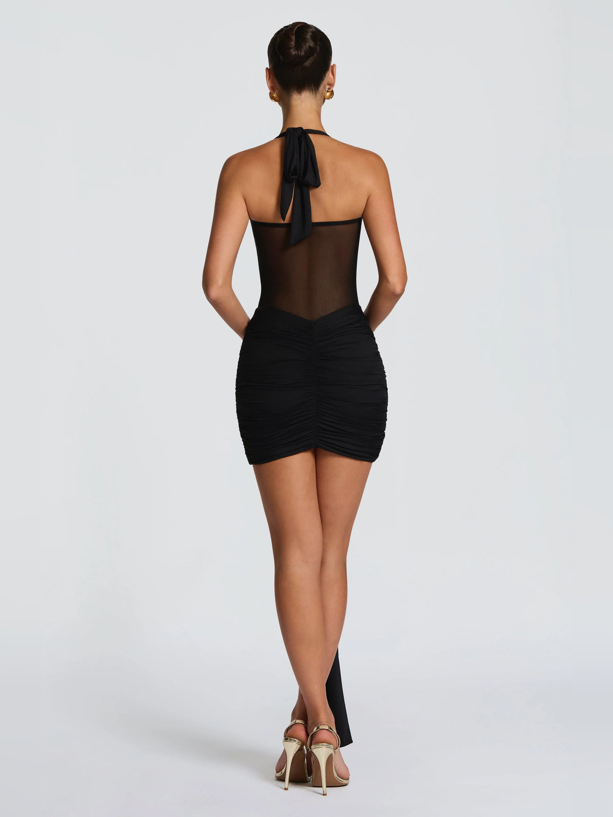 Black mini homecoming dress, alternate view showing the dress shape and hem