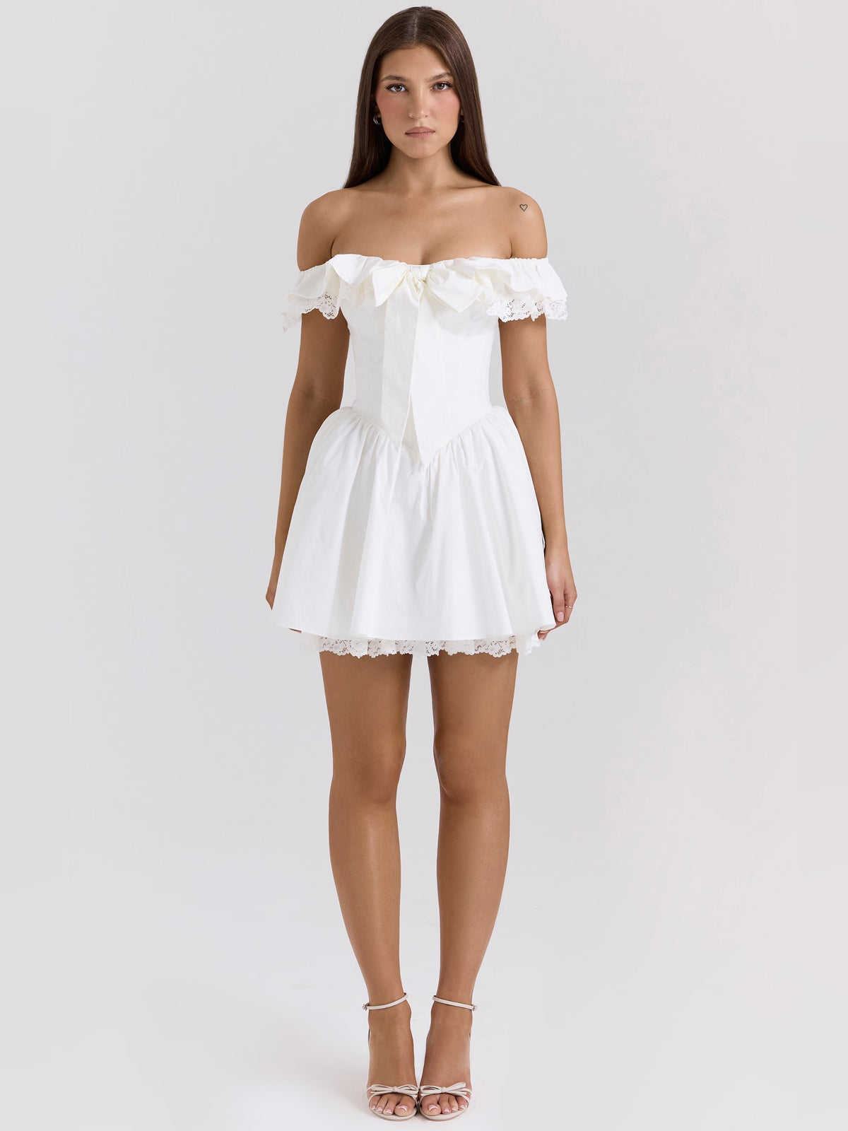 White mini homecoming dress, alternate view showing the dress shape and hem