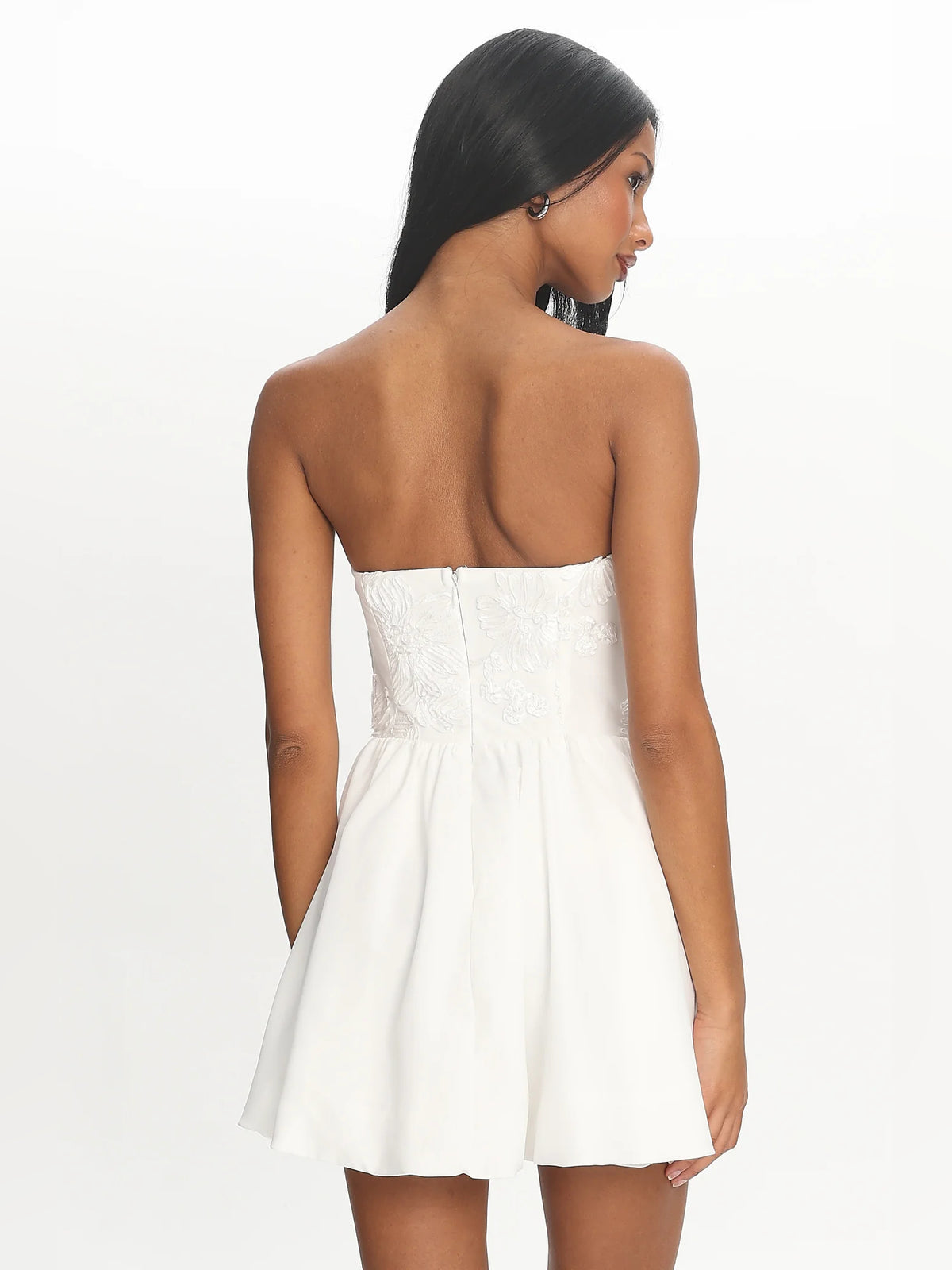 White mini homecoming dress, alternate view showing the dress shape and hem