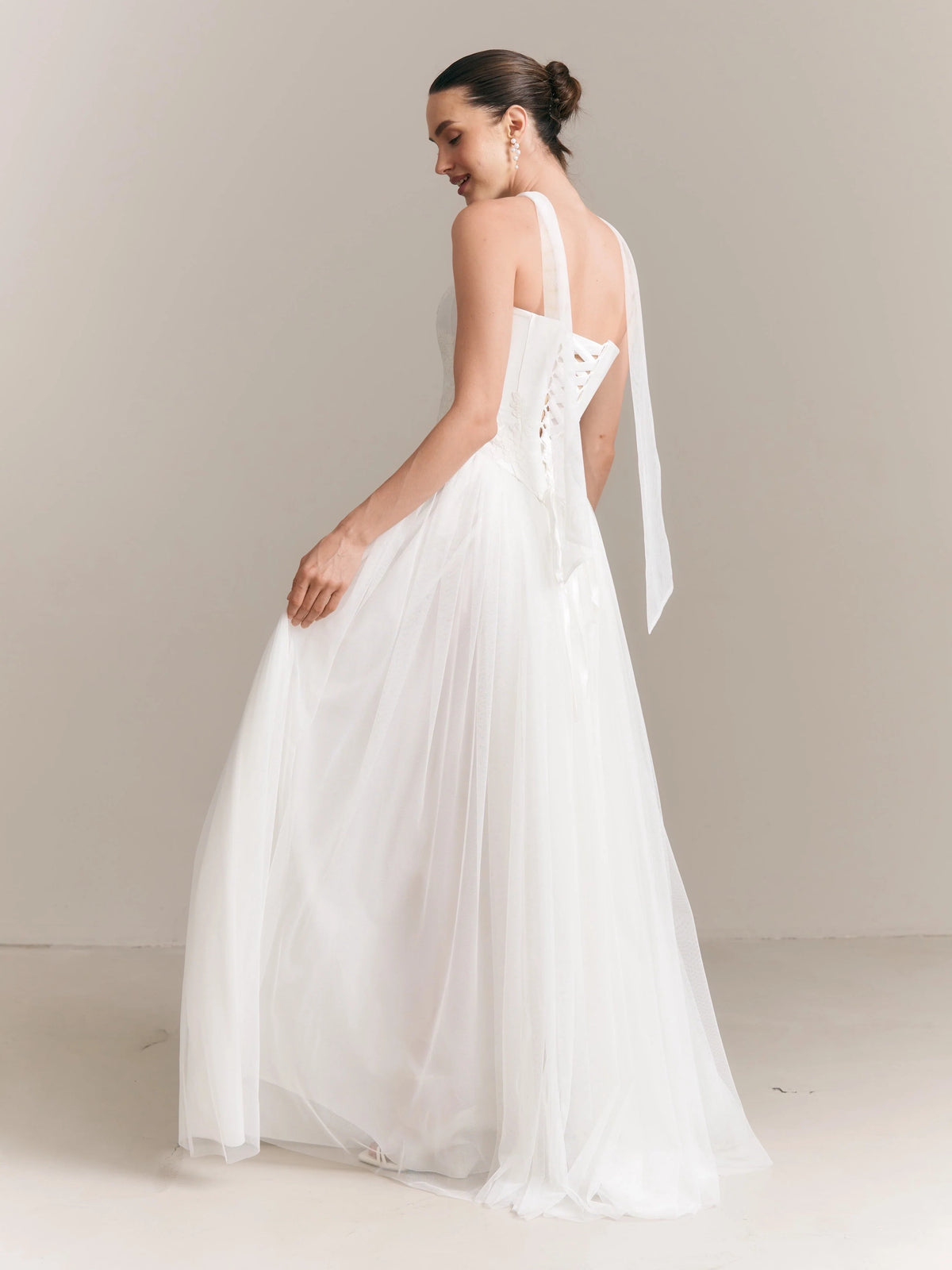 Ivory floor-length wedding dress, alternate view showing the dress shape and hem