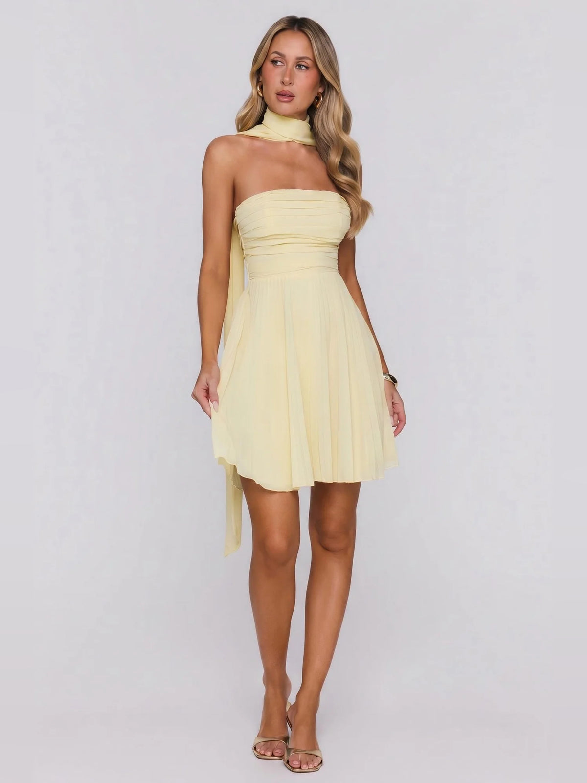 Yellow mini homecoming dress, alternate view showing the dress shape and hem
