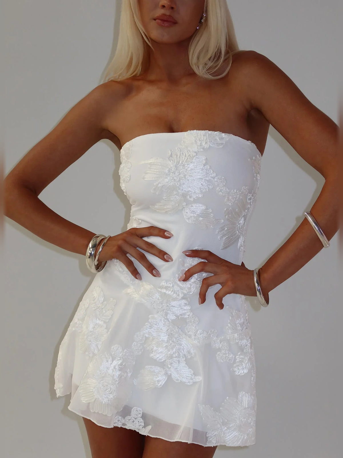White Floral mini homecoming dress, alternate view showing the dress shape and hem