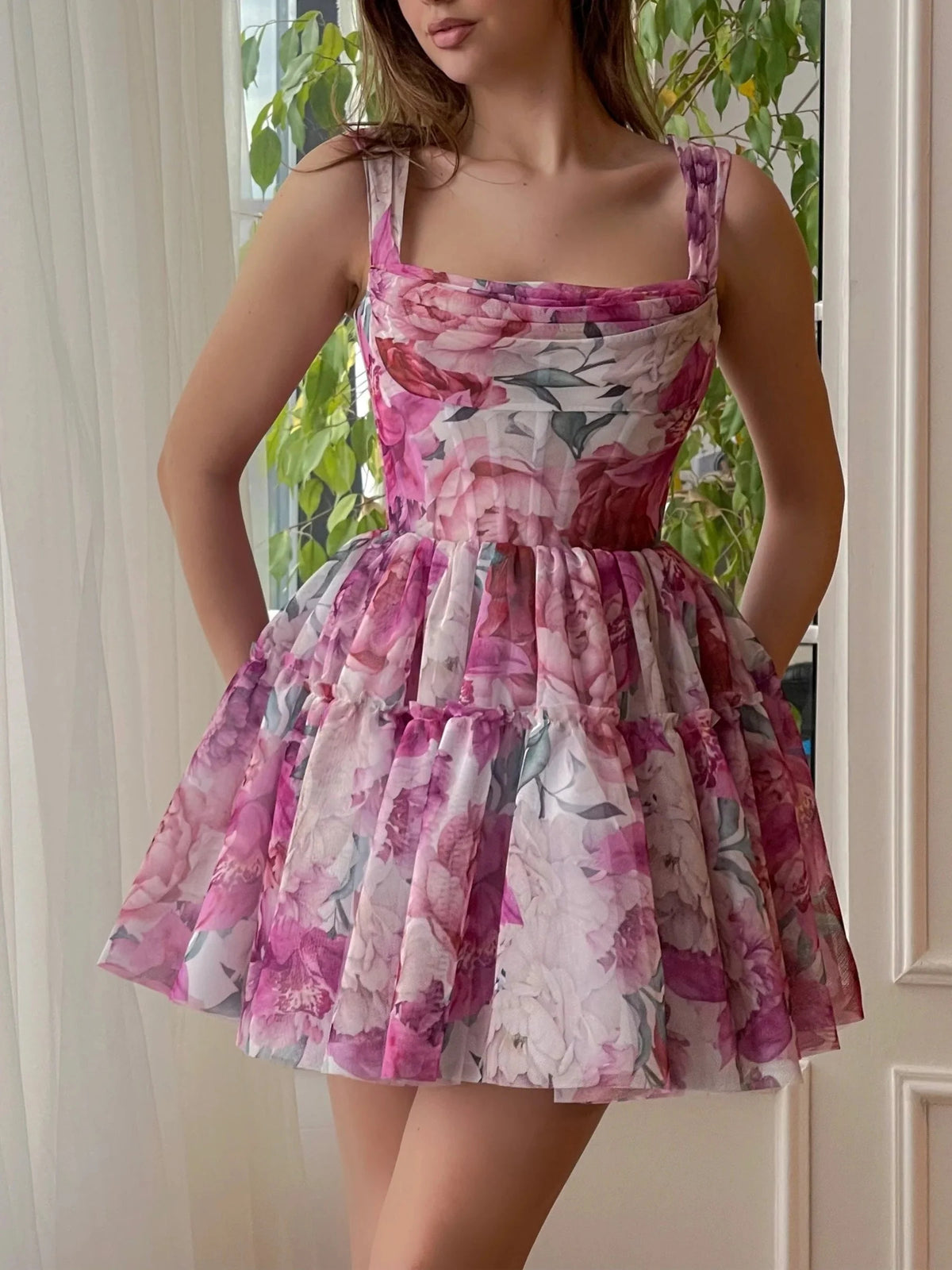 Floral mini homecoming dress, alternate view showing the dress shape and hem