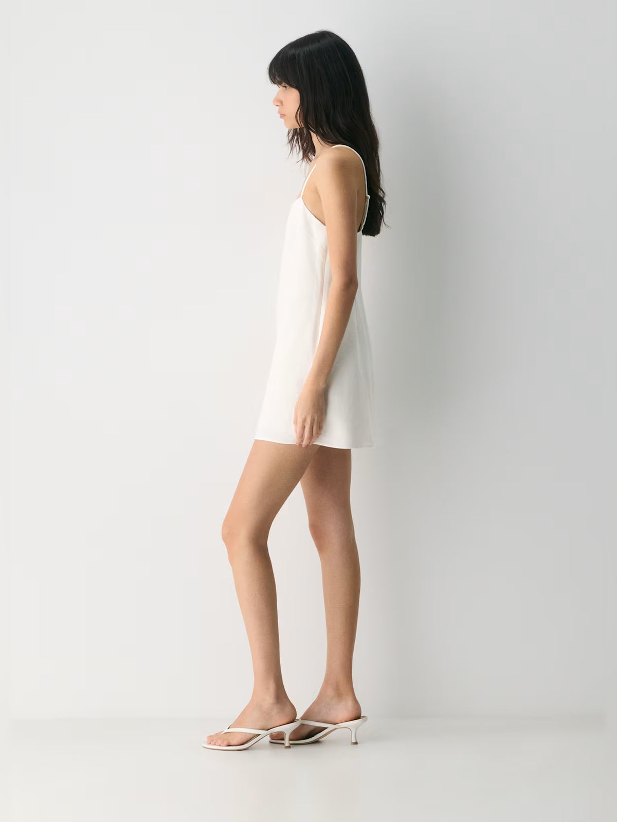 Orange mini homecoming dress, alternate view showing the dress shape and hem