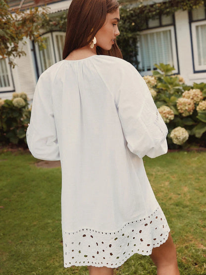 White mini homecoming dress, alternate view showing the dress shape and hem