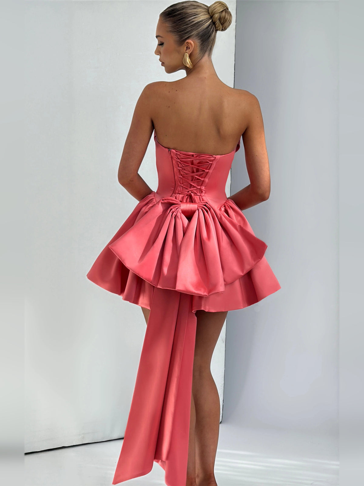 Pink mini homecoming dress, alternate view showing the dress shape and hem