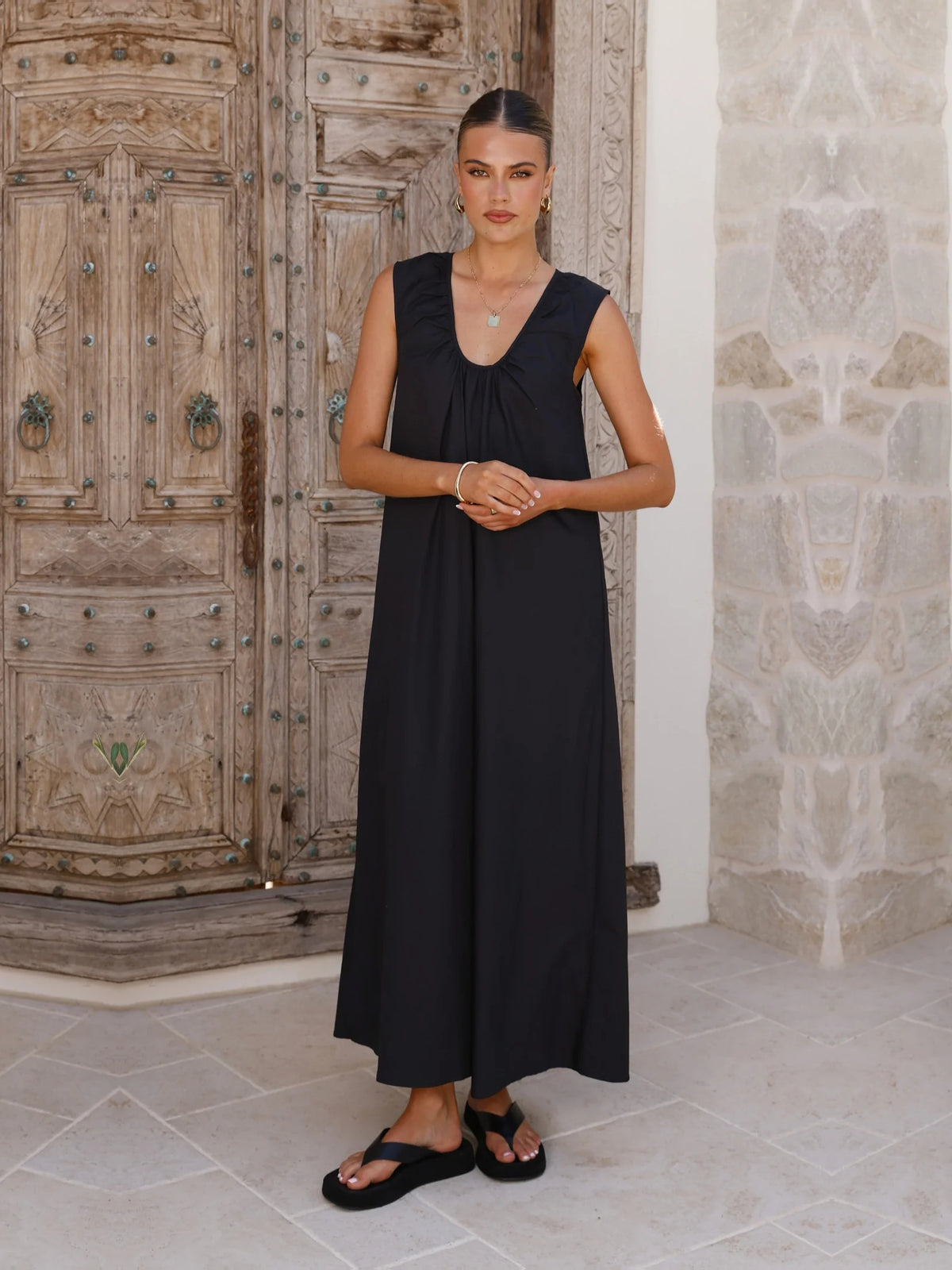 Black a-line maxi formal dress with halter neckline, alternate view