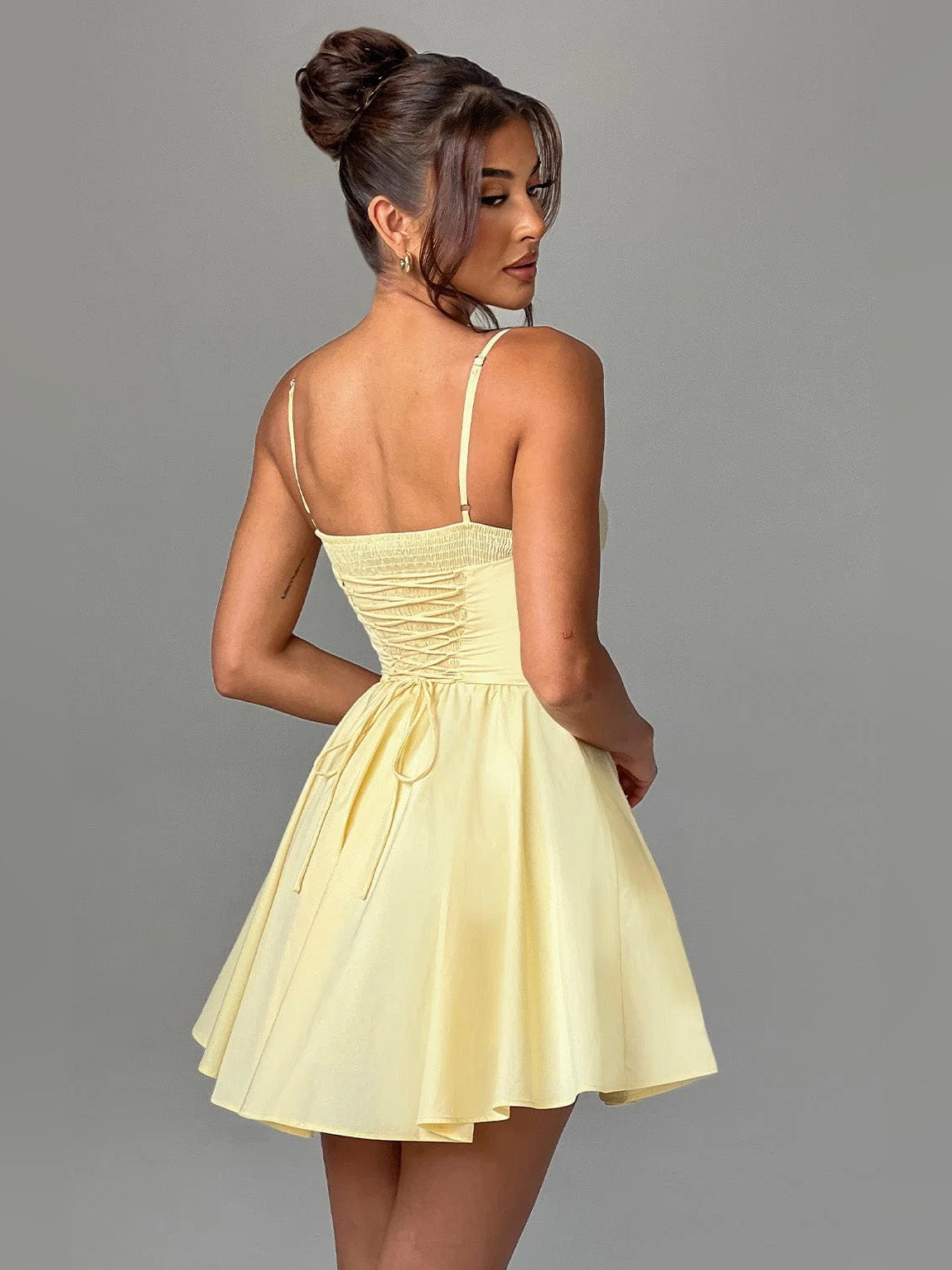 Lemon mini homecoming dress, alternate view showing the dress shape and hem