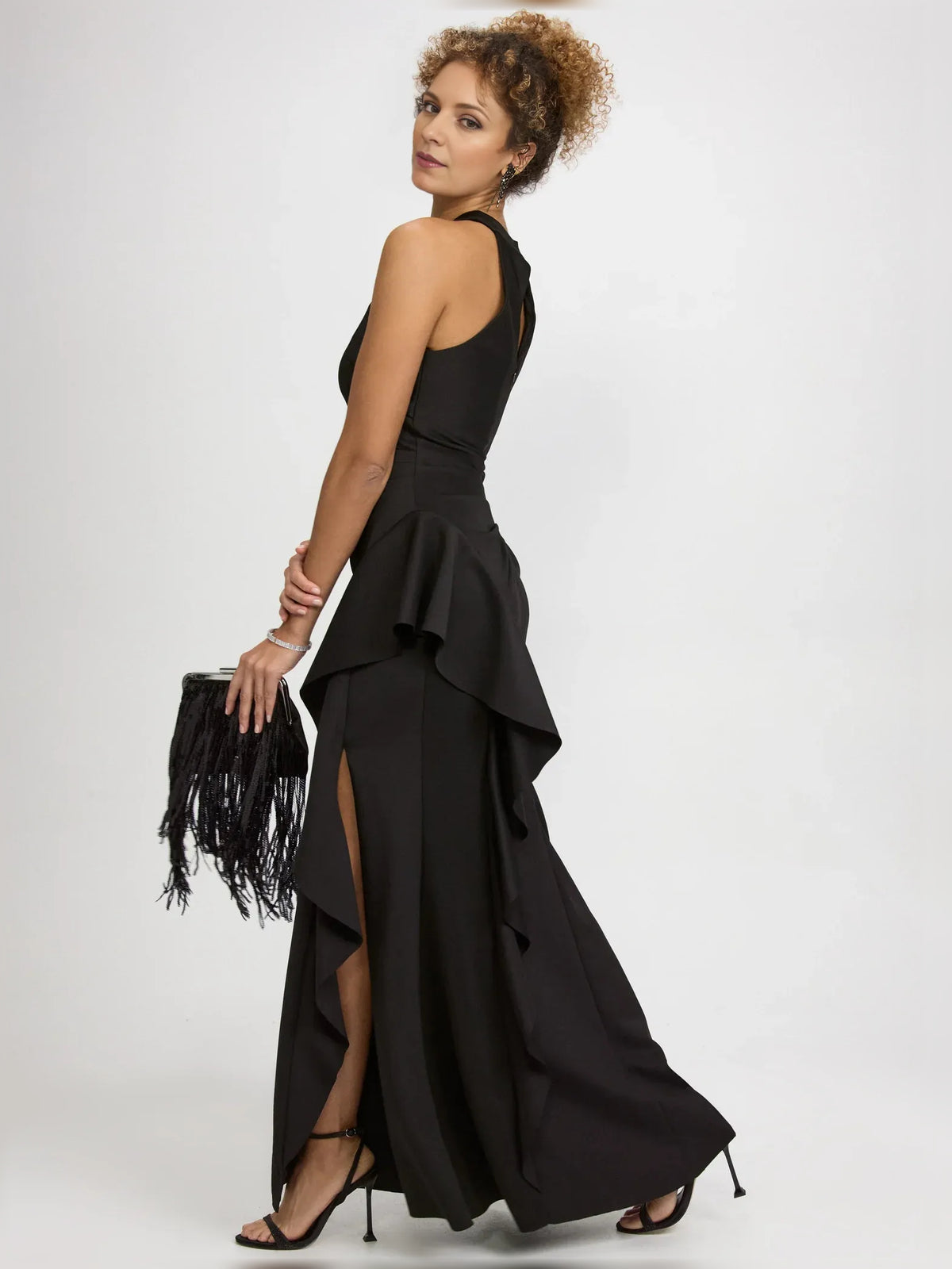 Black sheath floor-length formal dress with skirt slit, alternate view showing the waist