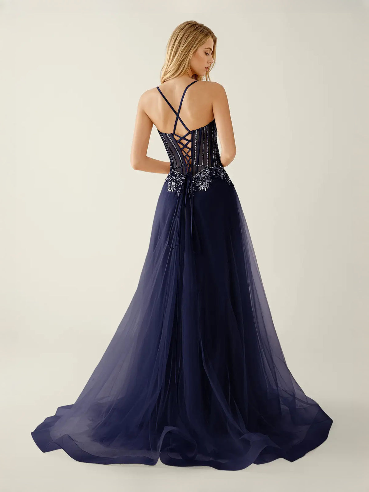Navy Blue floor-length prom dress, back view showing the rear of the dress in an additional pose