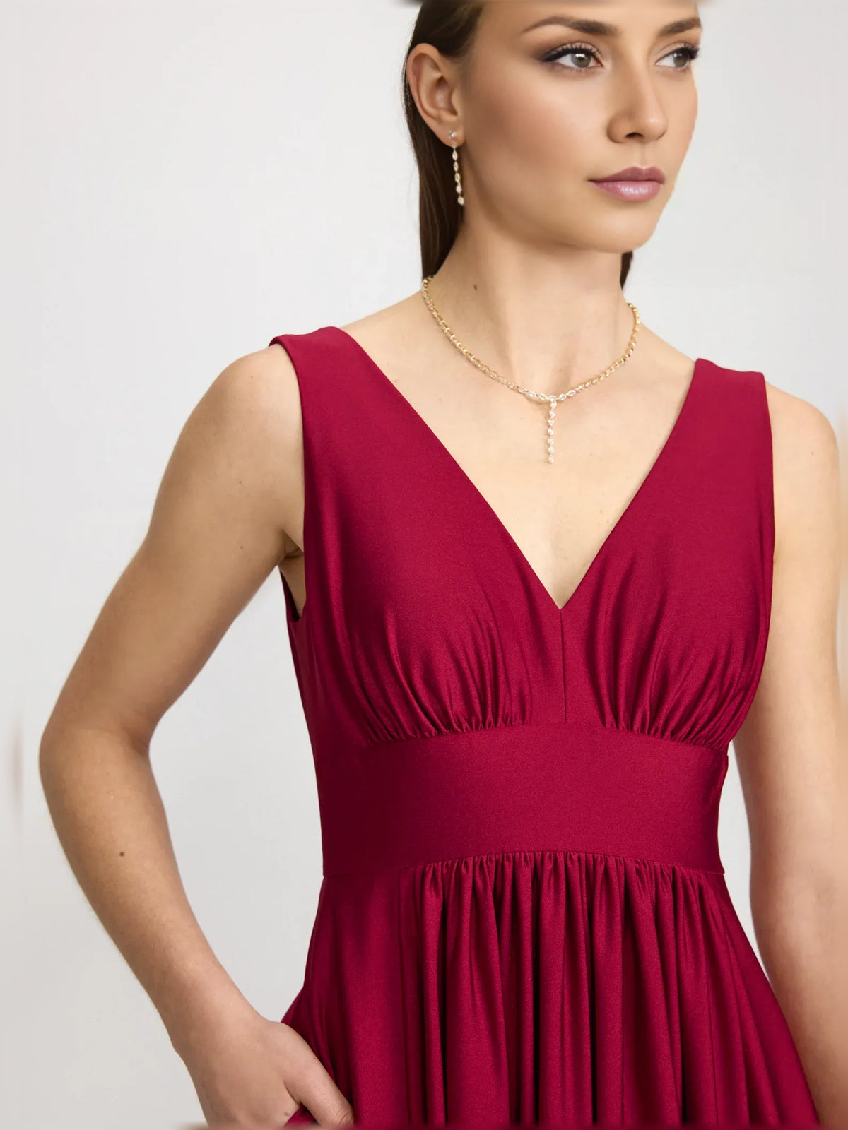 Red a-line floor-length formal dress with skirt slit, alternate view showing the waist