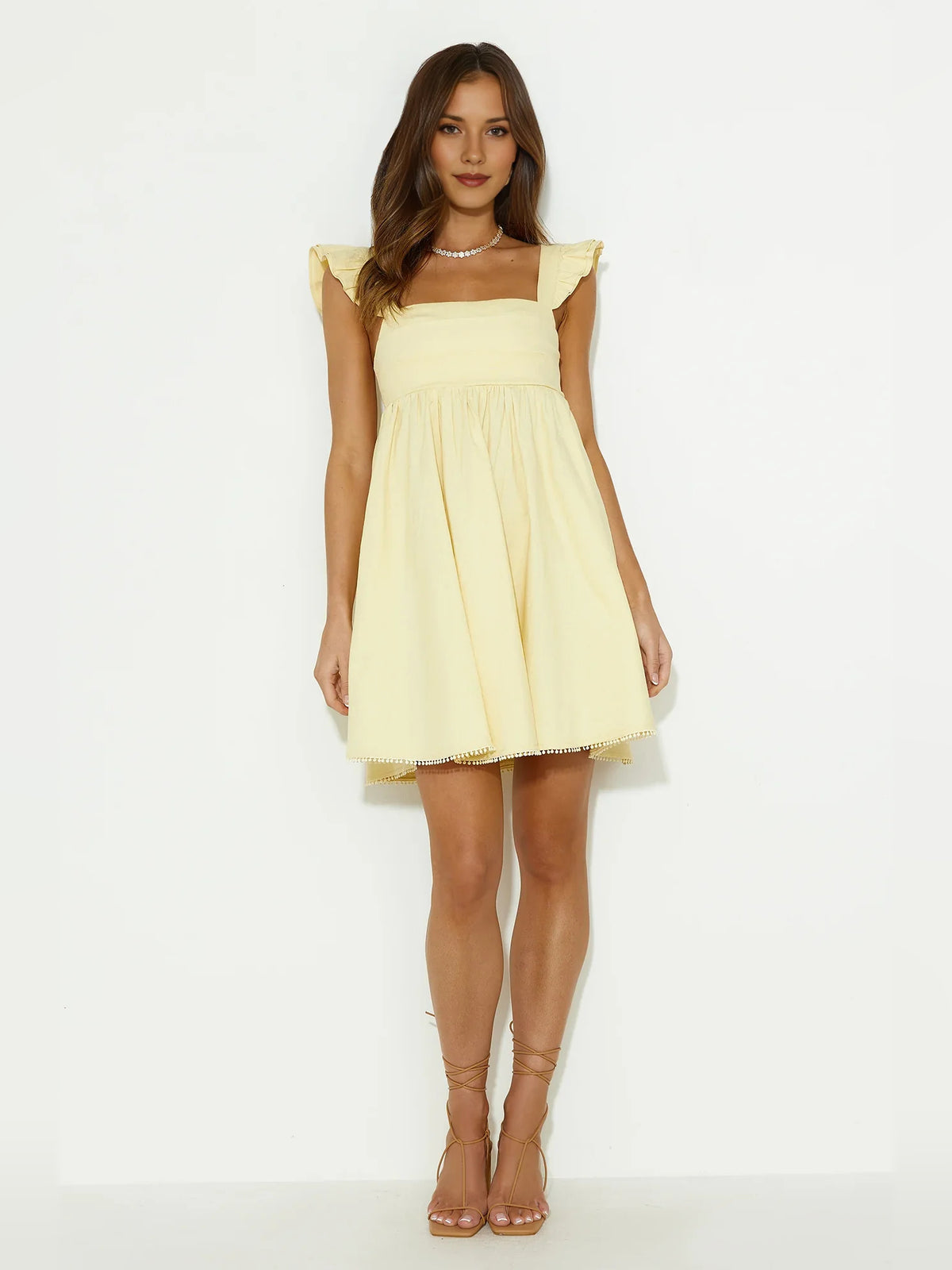 Yellow mini homecoming dress, alternate view showing the overall dress design