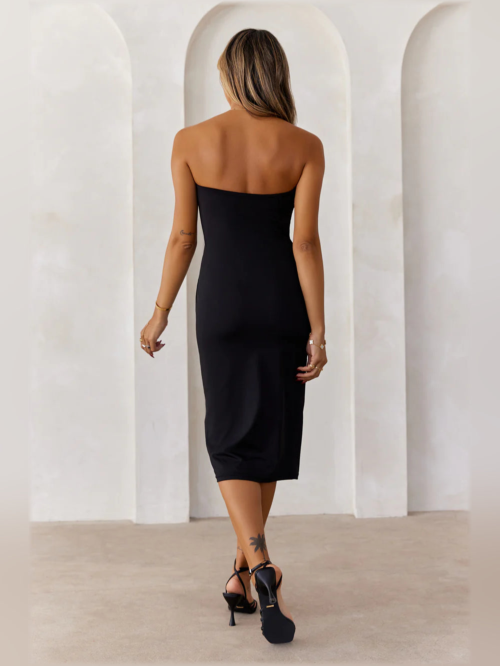 Black bodycon midi formal dress with strapless neckline, alternate view showing the waist