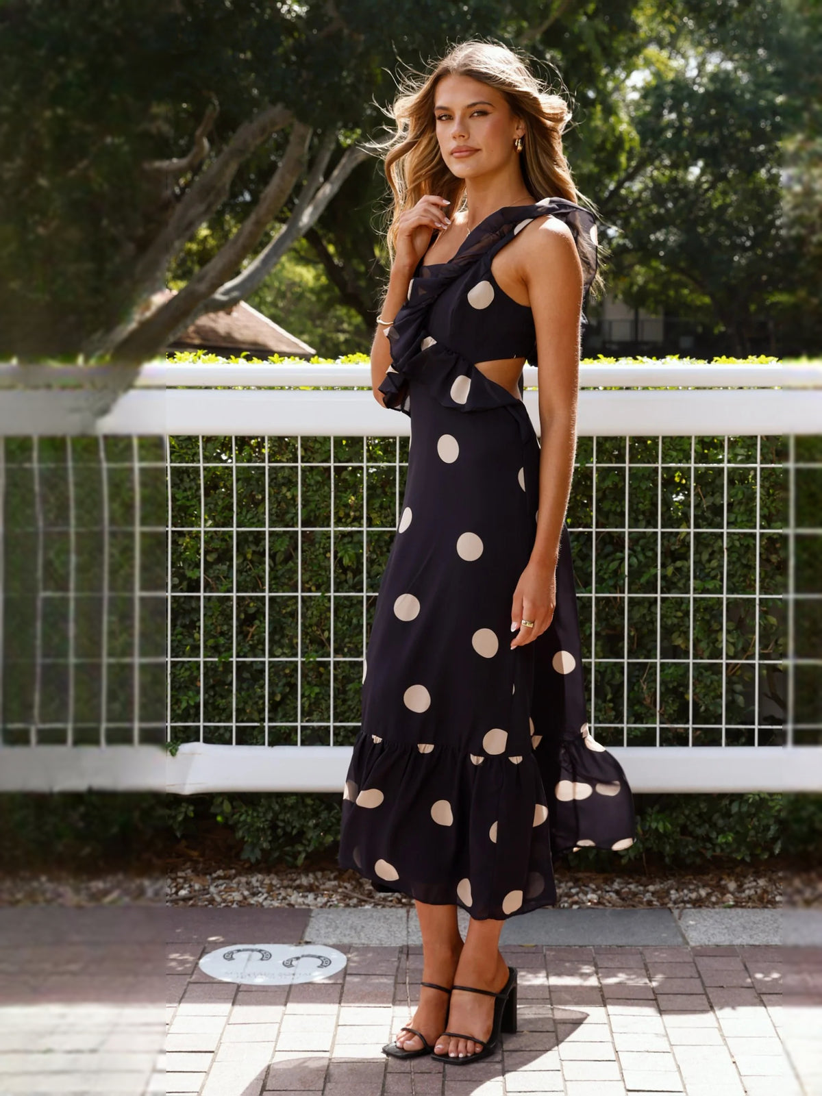 Black midi formal dress with printed pattern, alternate view showing the waist
