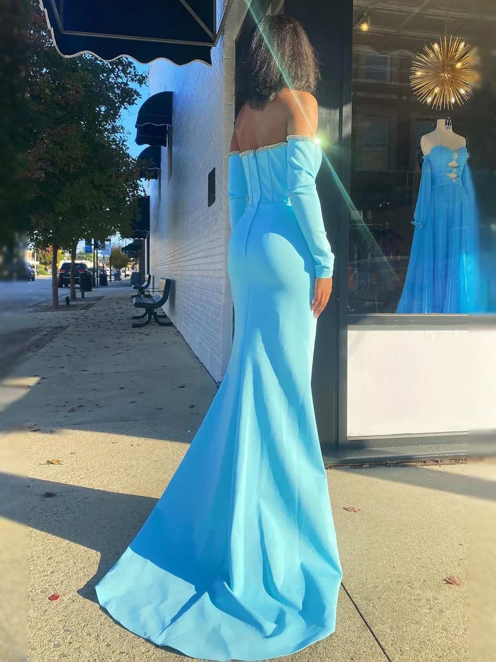 Light Blue maxi prom dress, back view showing the rear of the dress in an additional pose