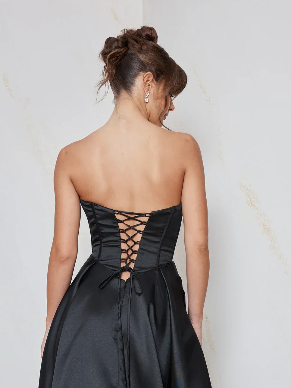 Black a-line floor-length formal dress with corset-style bodice, alternate view showing the waist