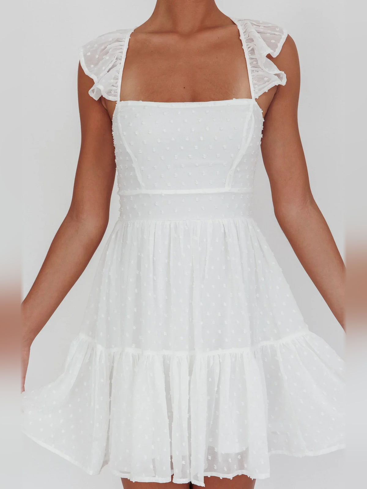 White mini homecoming dress, alternate view showing the overall dress design