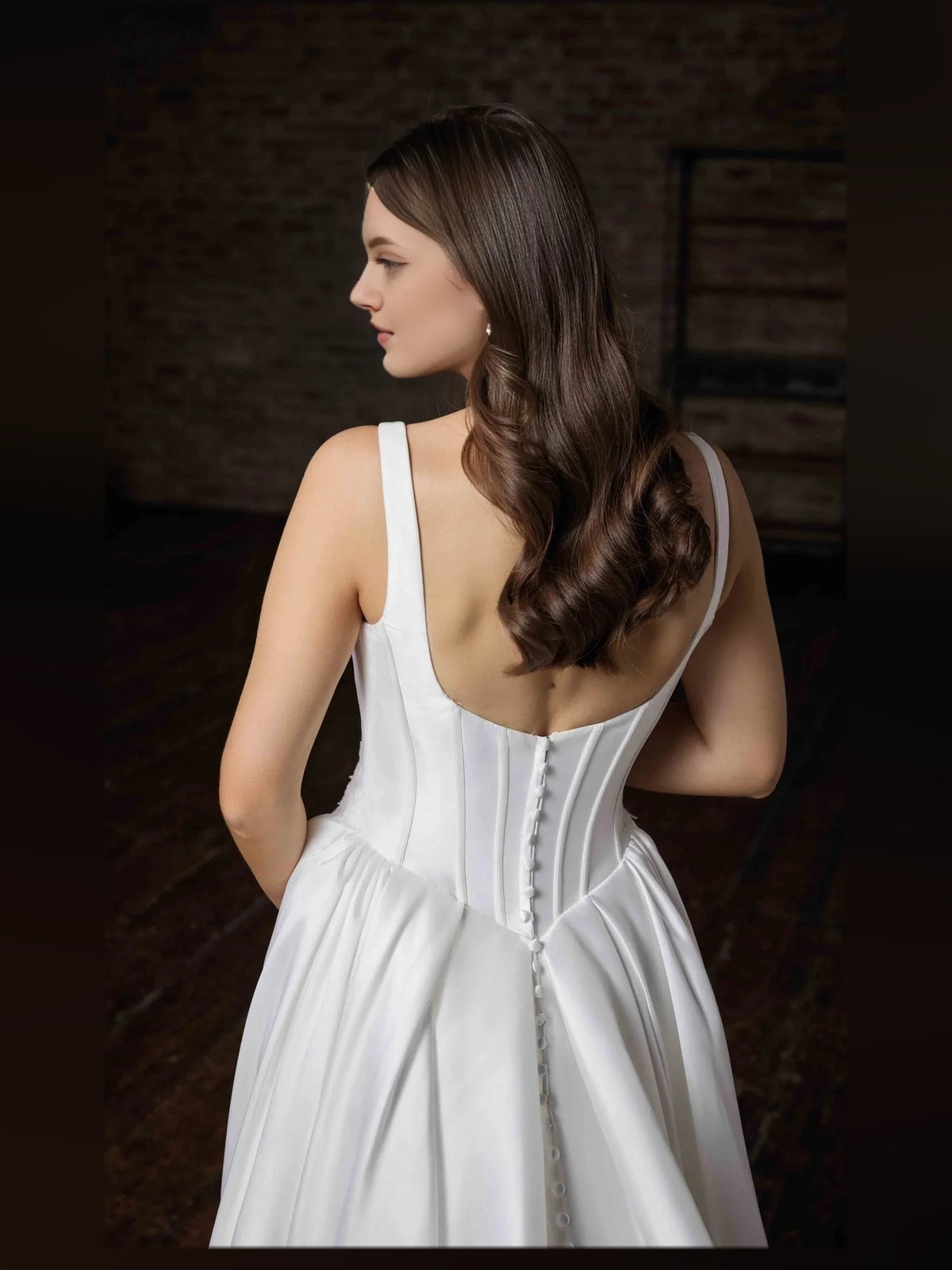 Ivory floor-length wedding dress, alternate view showing the skirt and hem
