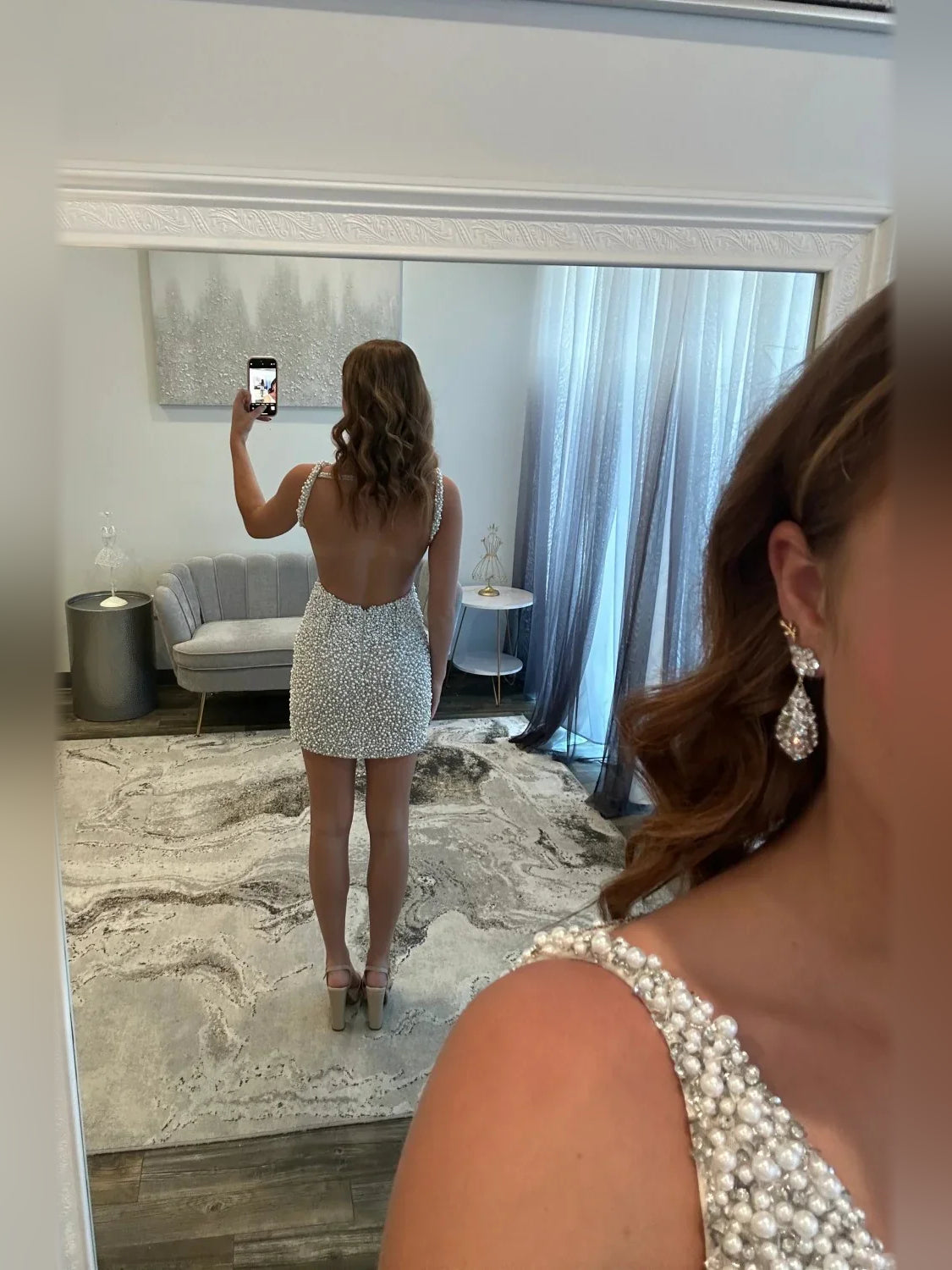 White mini homecoming dress, alternate view showing the skirt and hem