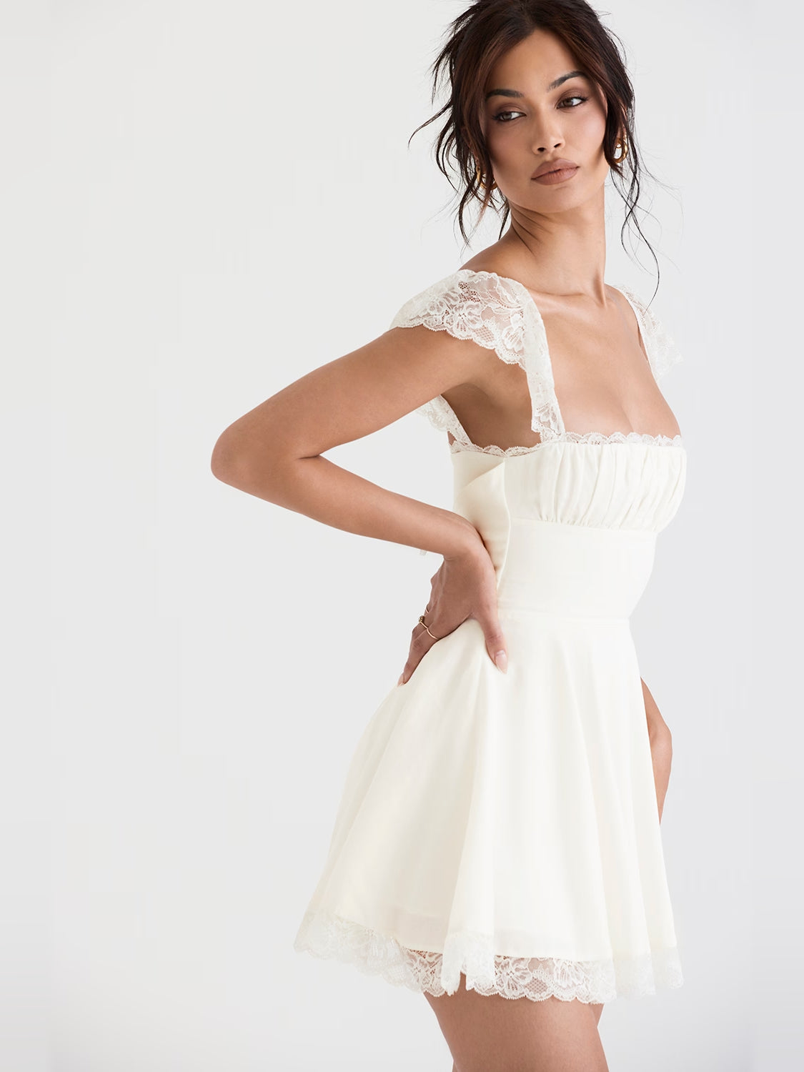 Ivory mini homecoming dress, alternate view showing the skirt and hem