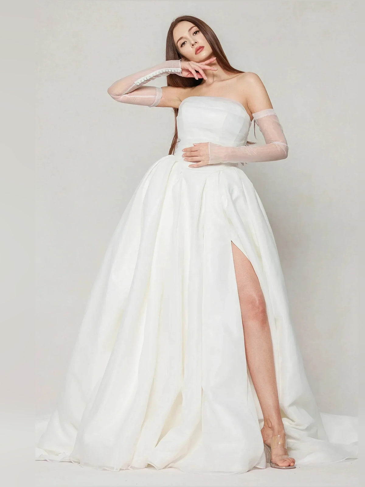 Ivory floor-length wedding dress, alternate view showing the skirt and hem