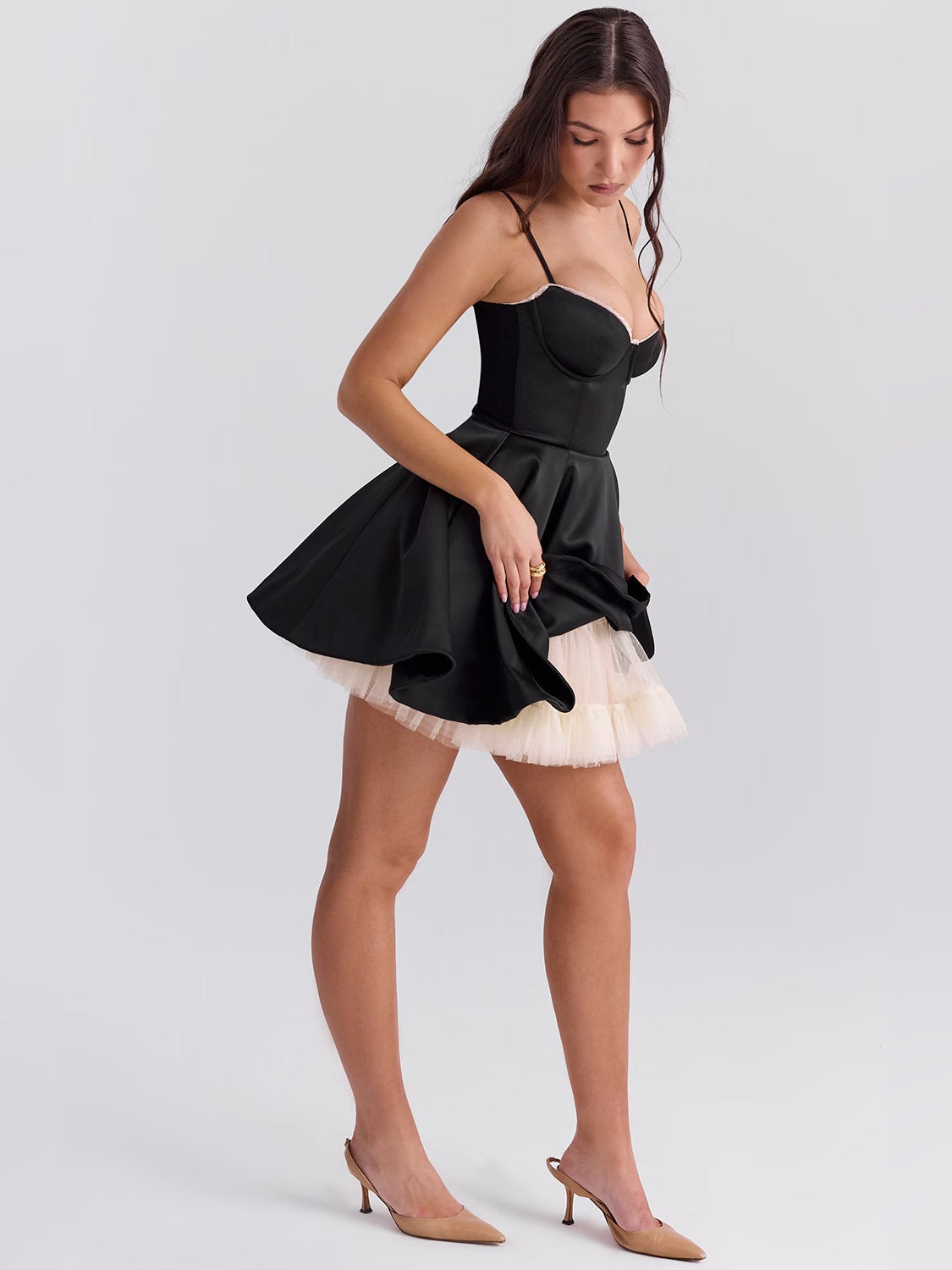 Black mini homecoming dress, alternate view showing the skirt and hem