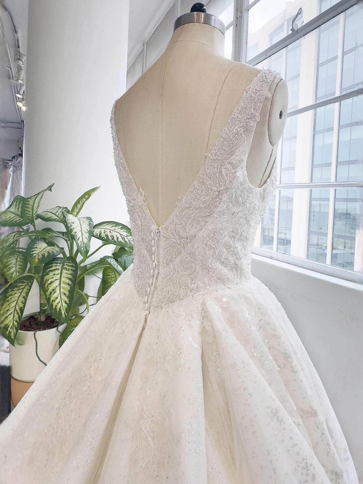 Ivory floor-length wedding dress, alternate view showing the skirt and hem