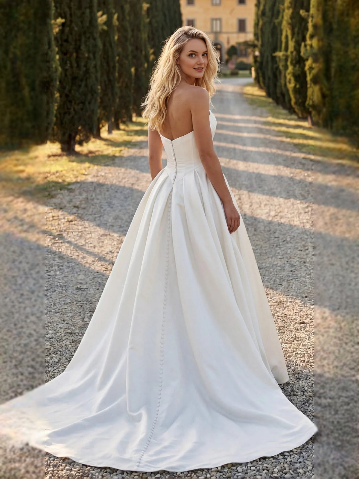 Ivory floor-length wedding dress, alternate view showing the skirt and hem