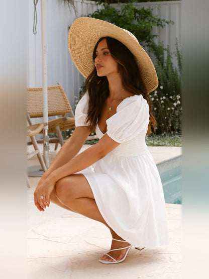 White mini homecoming dress, alternate view showing the skirt and hem