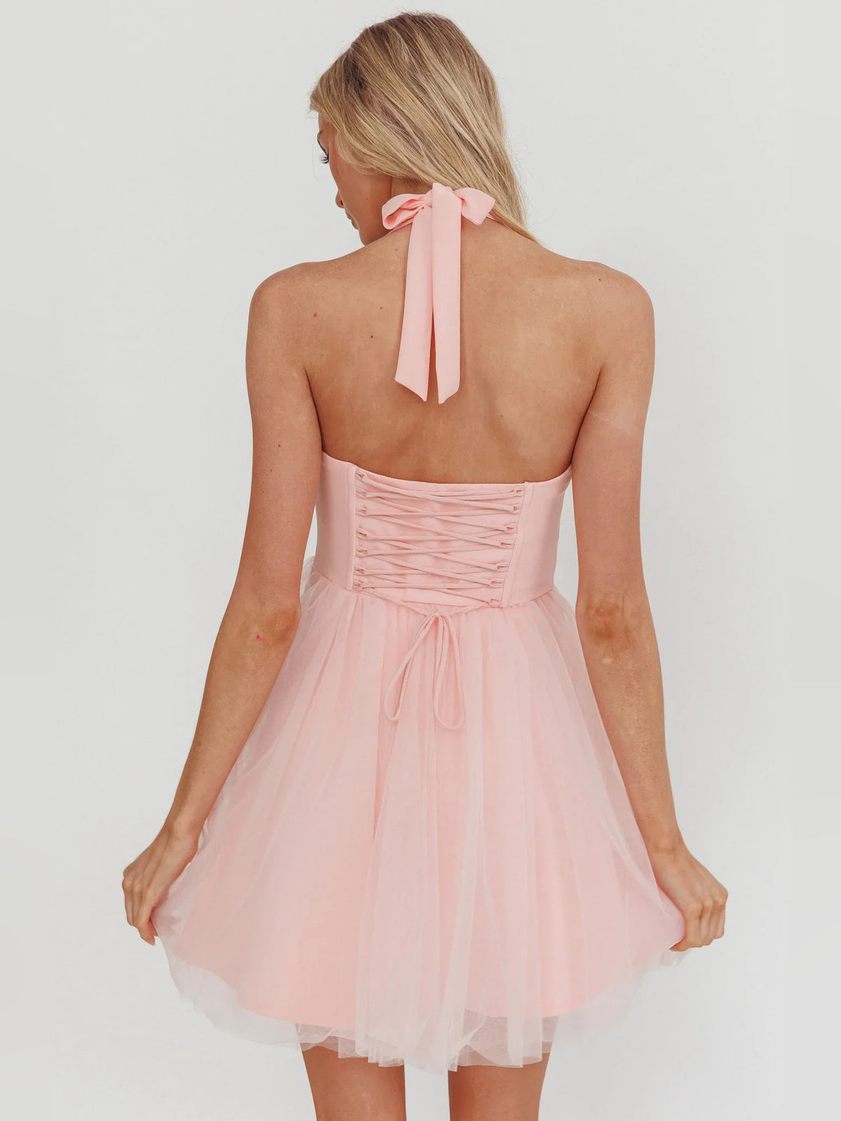 White mini homecoming dress, alternate view showing the skirt and hem