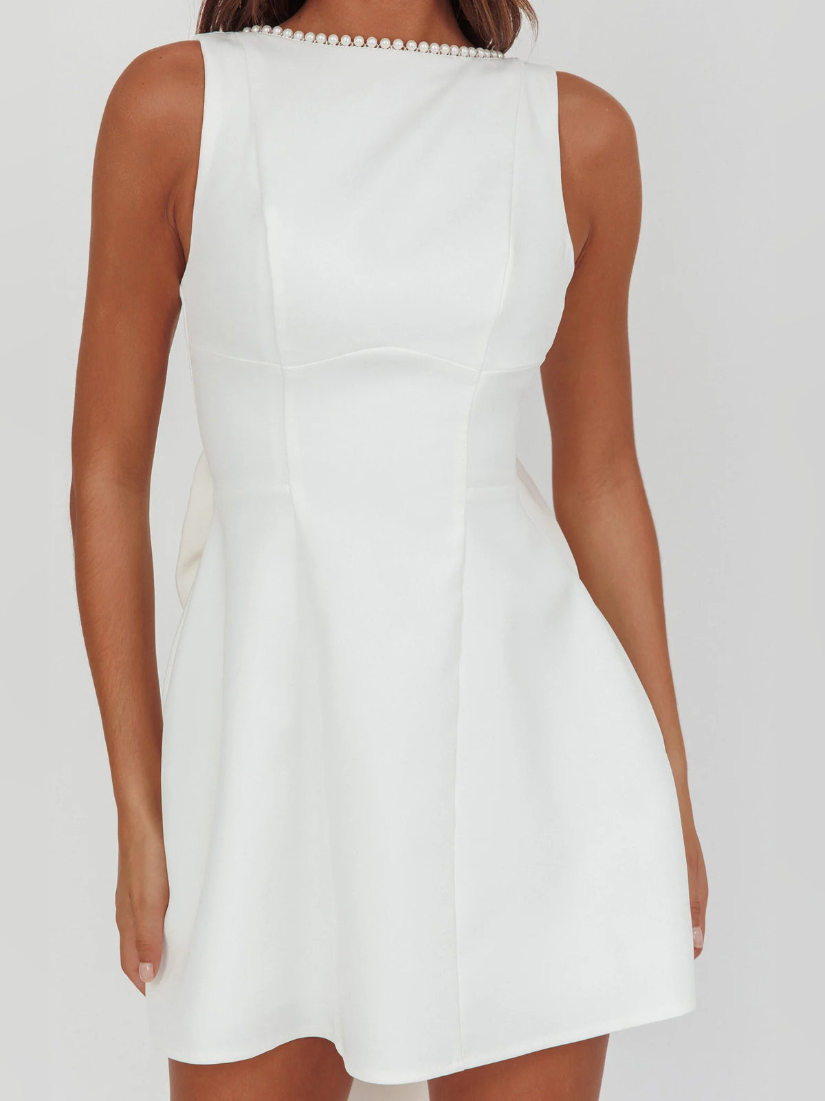 White mini homecoming dress, alternate view showing the skirt and hem