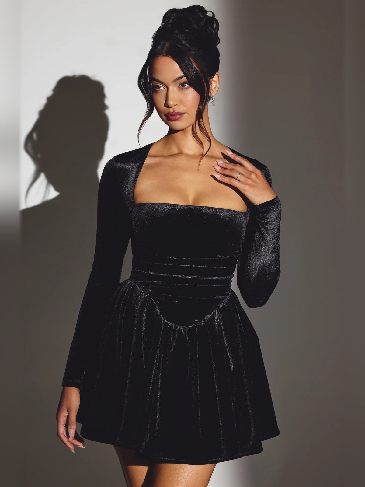 Black mini homecoming dress, alternate view showing the skirt and hem
