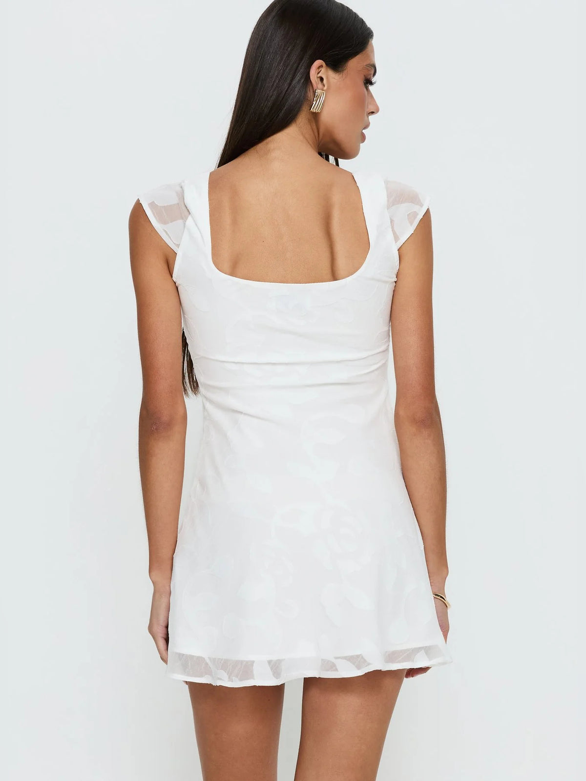 White Floral mini homecoming dress, alternate view showing the skirt and hem