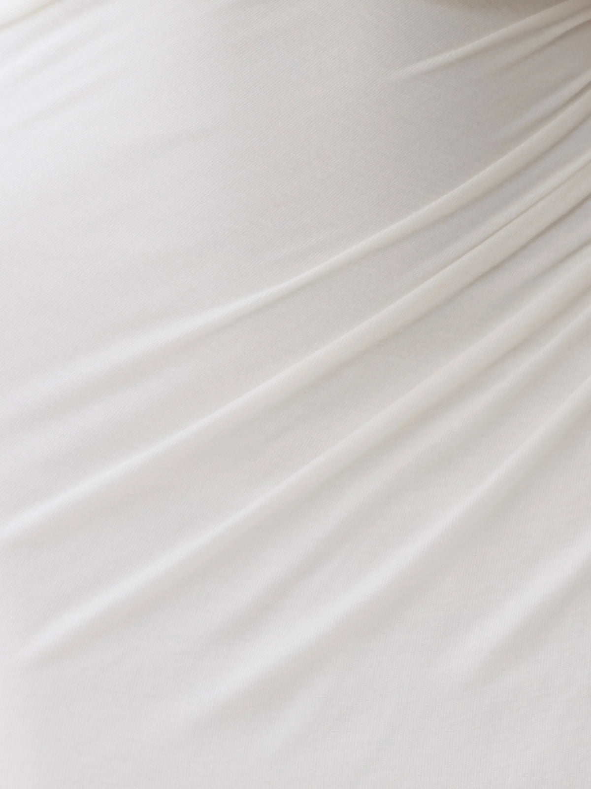 White midi formal dress with draping, alternate view showing the skirt