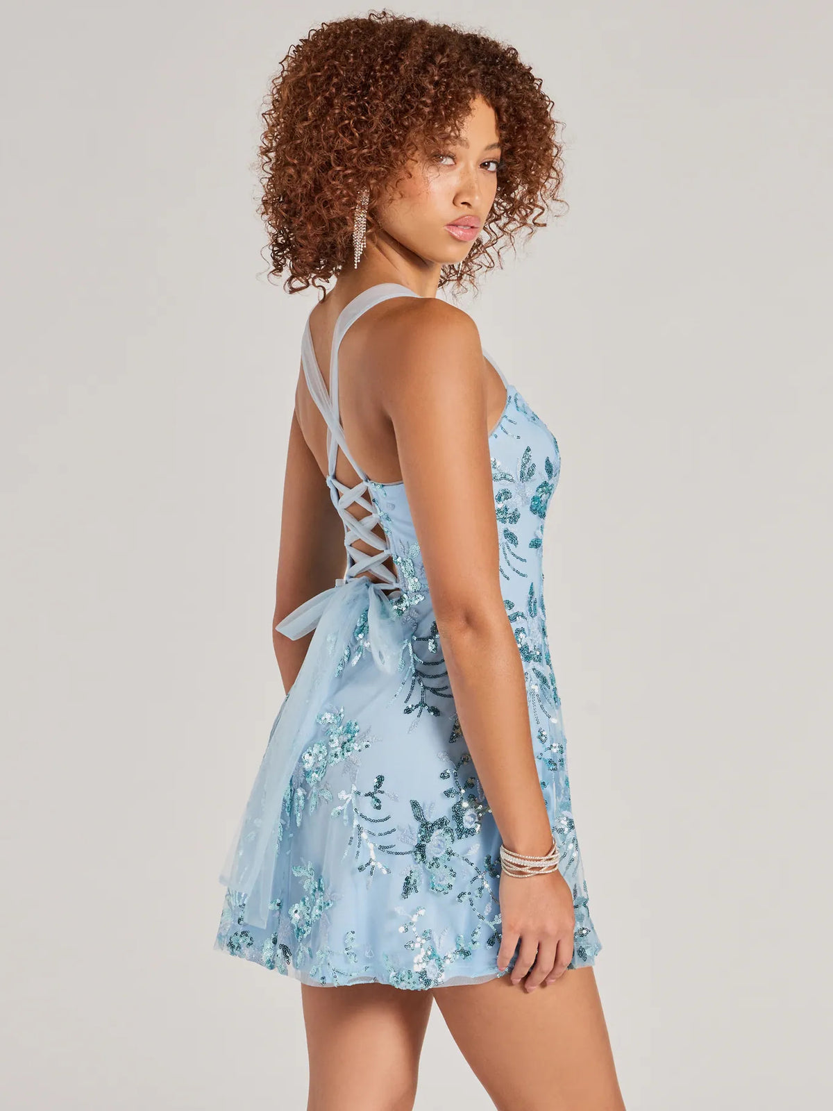 Floral mini homecoming dress, alternate view showing the skirt and hem