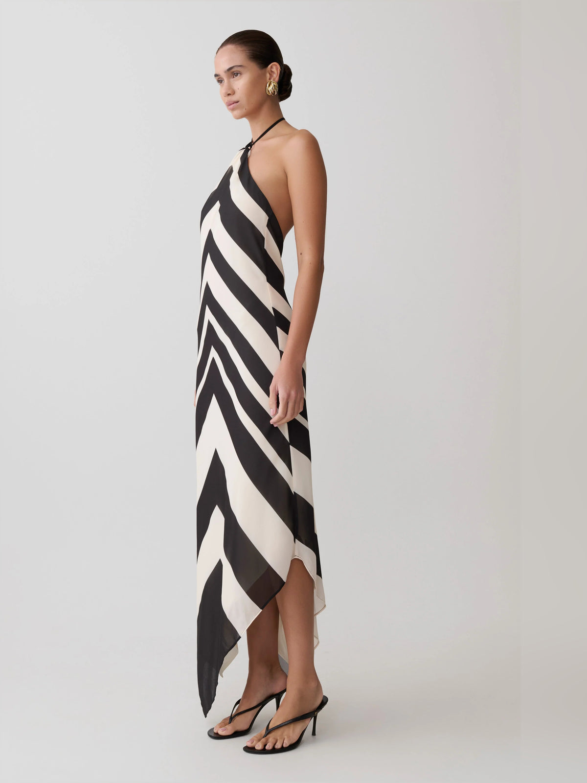 White midi formal dress with halter neckline, alternate view showing the skirt