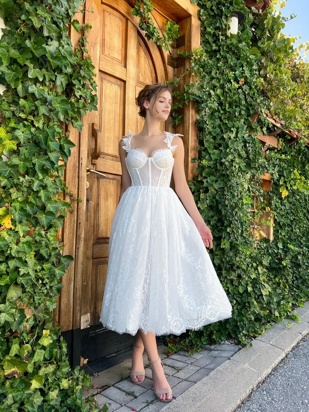 White a-line tea-length formal dress with corset-style bodice, alternate view showing the skirt