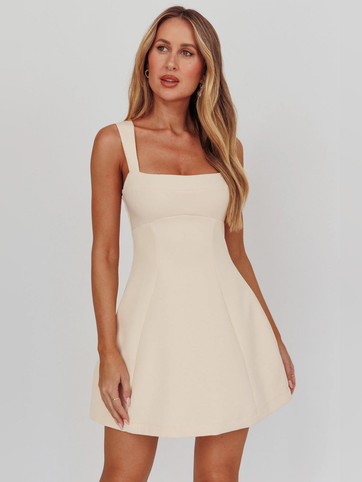 Apricot mini homecoming dress, alternate view showing the skirt and hem