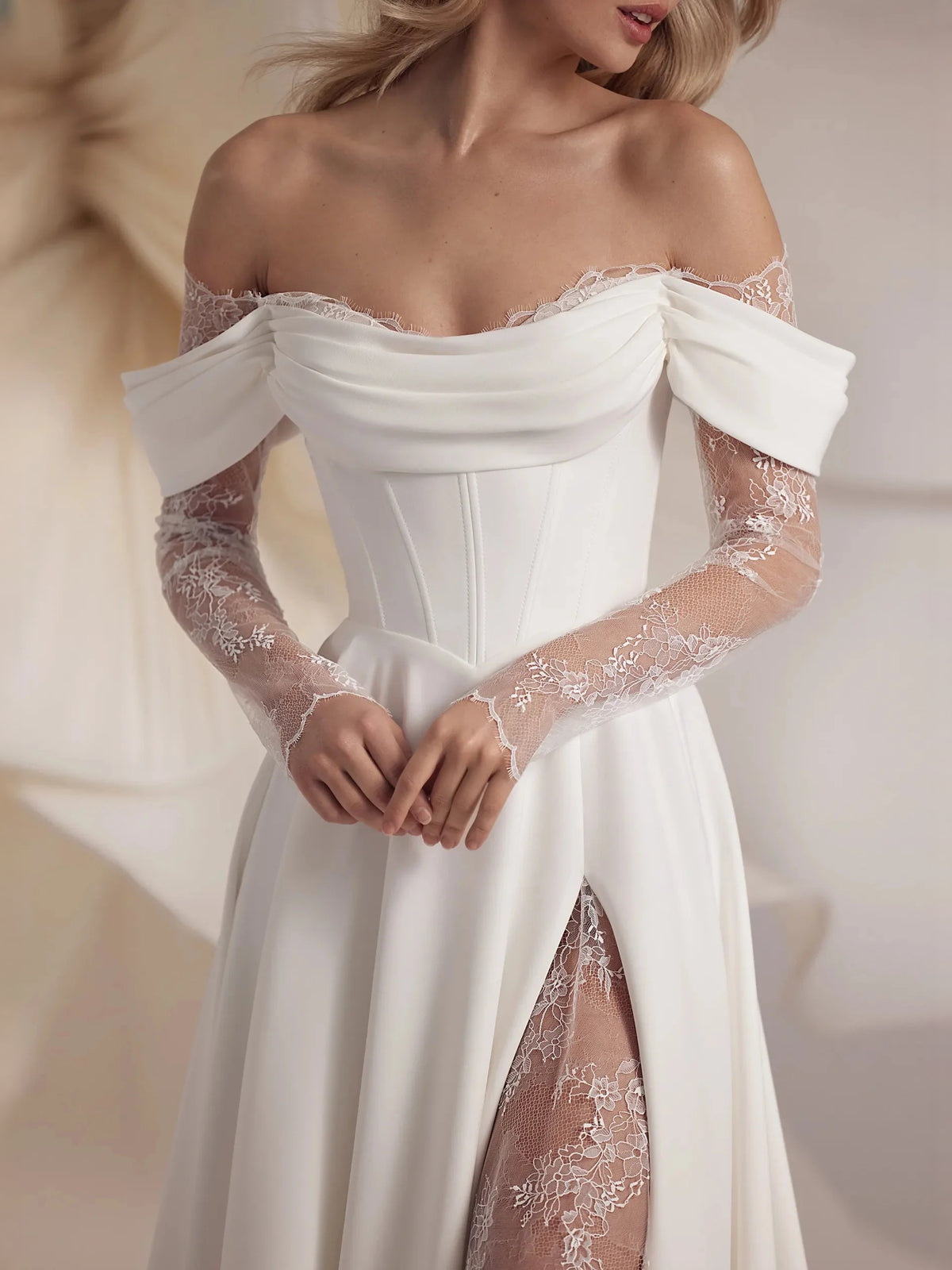 Ivory floor-length wedding dress, alternate view showing the skirt and hem
