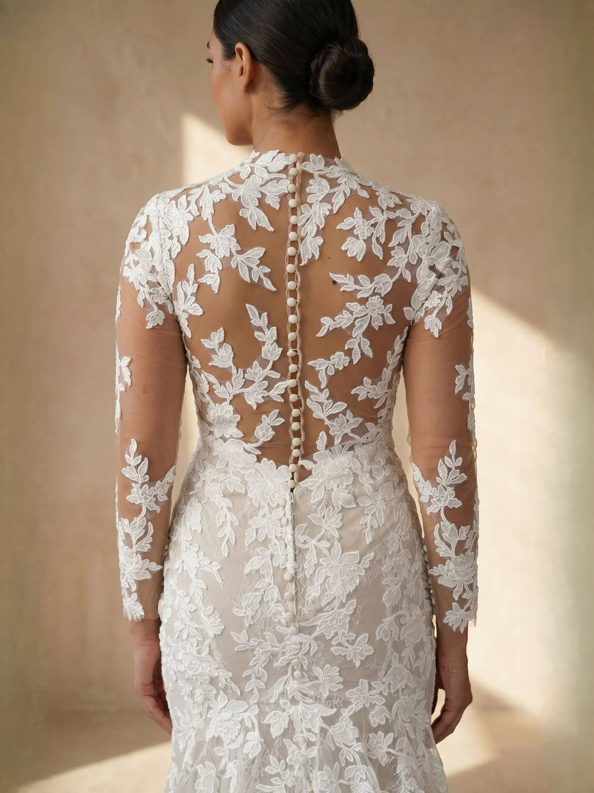 Ivory floor-length wedding dress, alternate view showing the skirt and hem