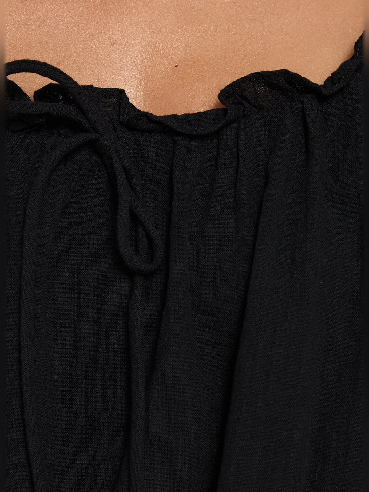 Black mini homecoming dress, alternate view showing the skirt and hem