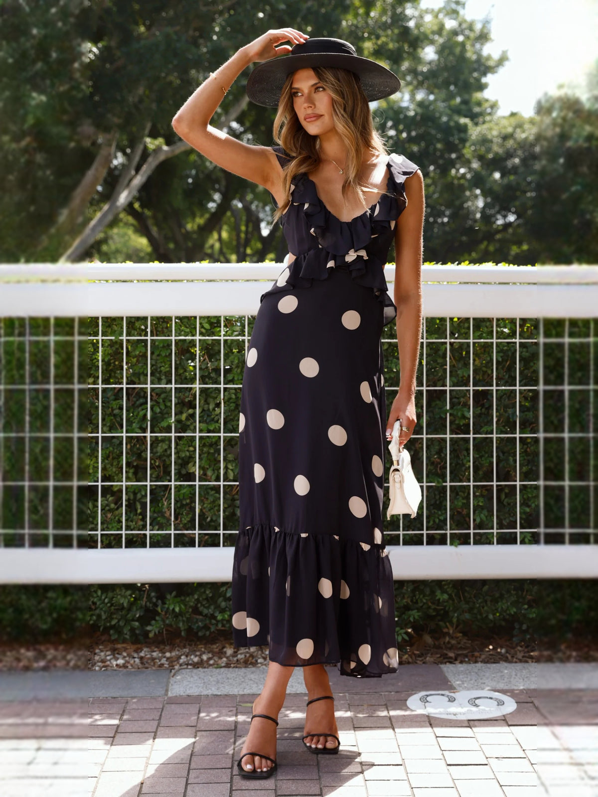 Black midi formal dress with printed pattern, alternate view showing the skirt